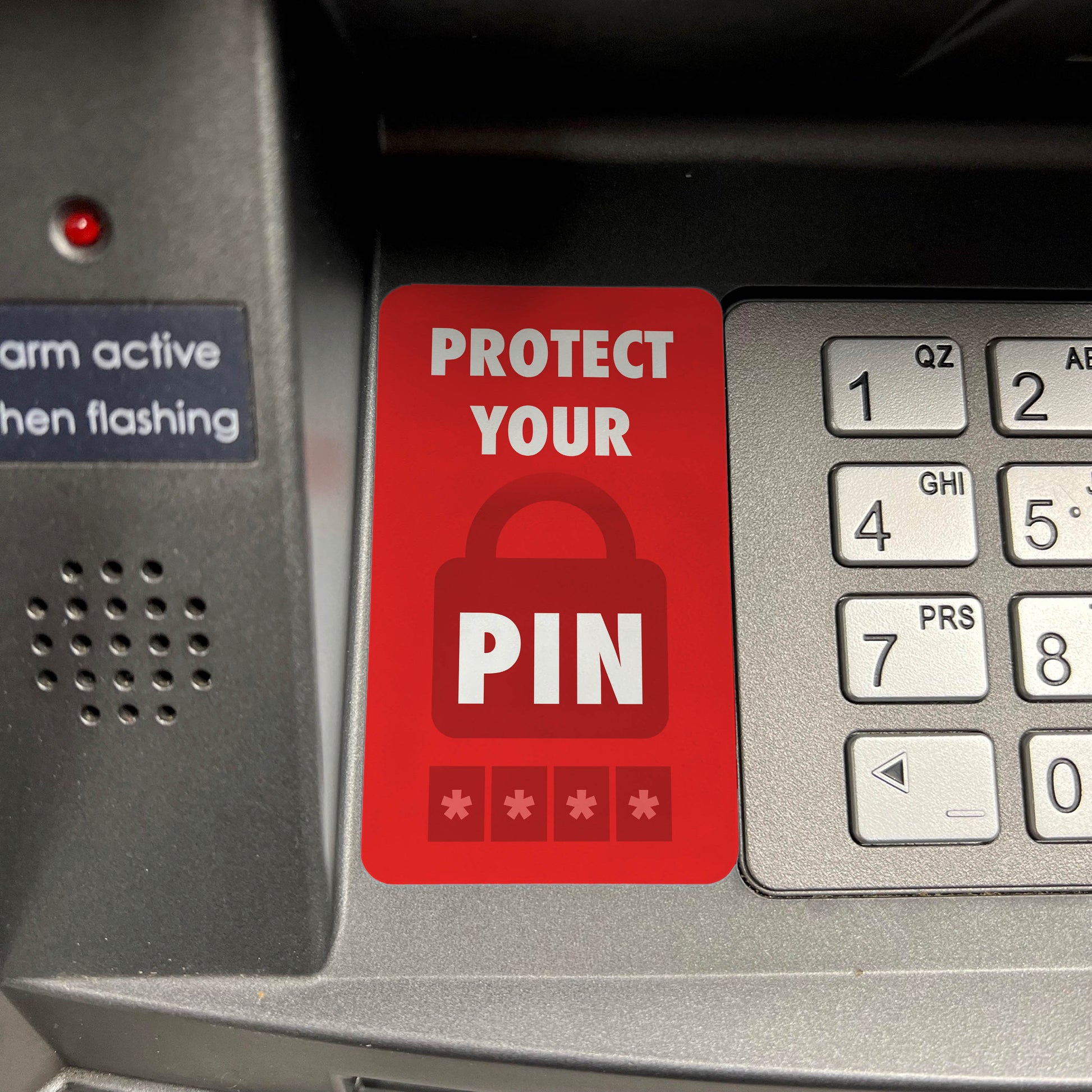 "Protect your PIN" Decal in use, on a Genmega 2500 keypad.