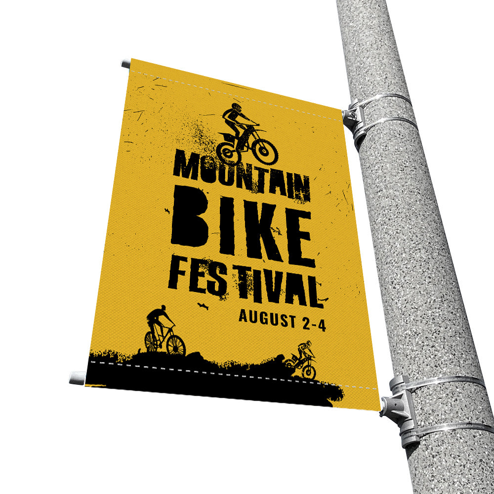Street pole banner advertising a mountain bike festival